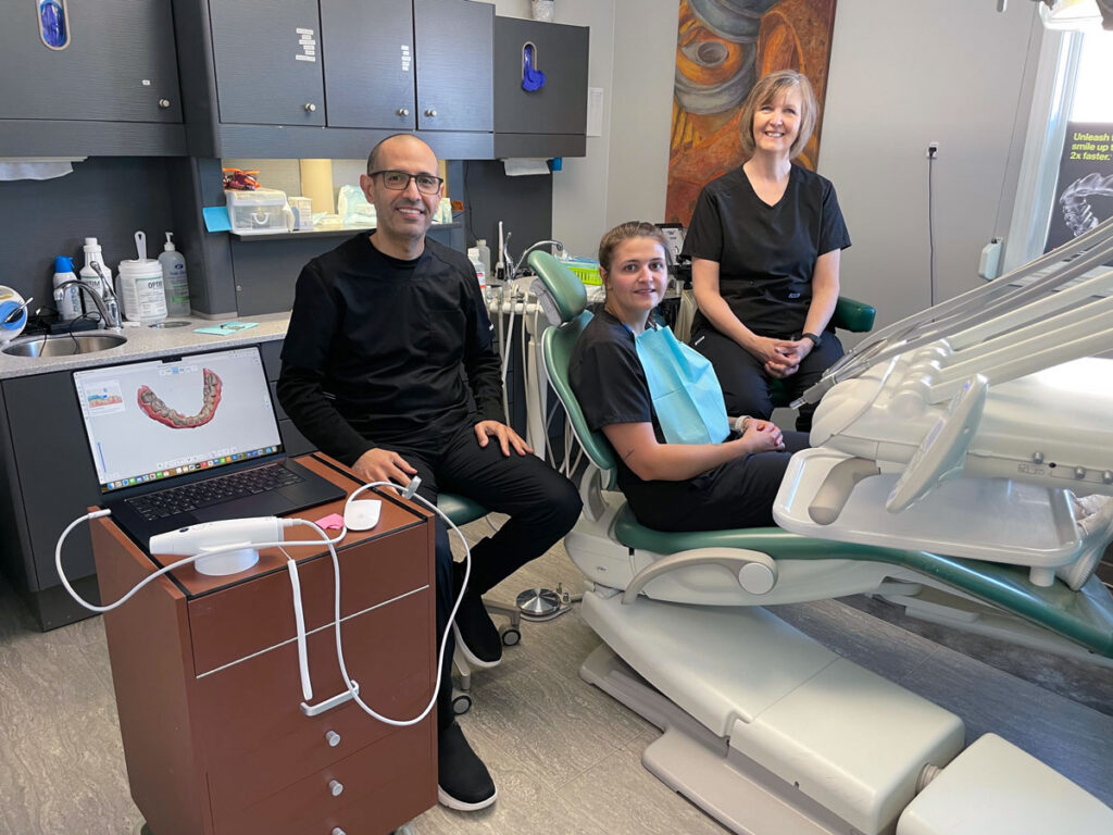 Westlock Family Dental team caring for patient in dental chair